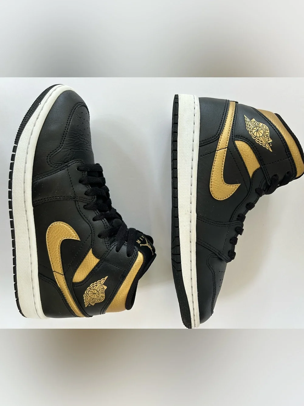 Air Jordan Black and Gold High-Top Sneakers